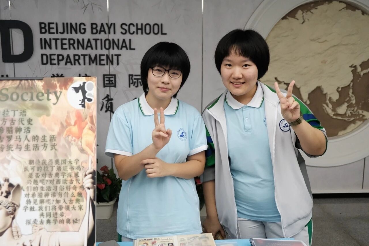 Classical society Two students at club booth