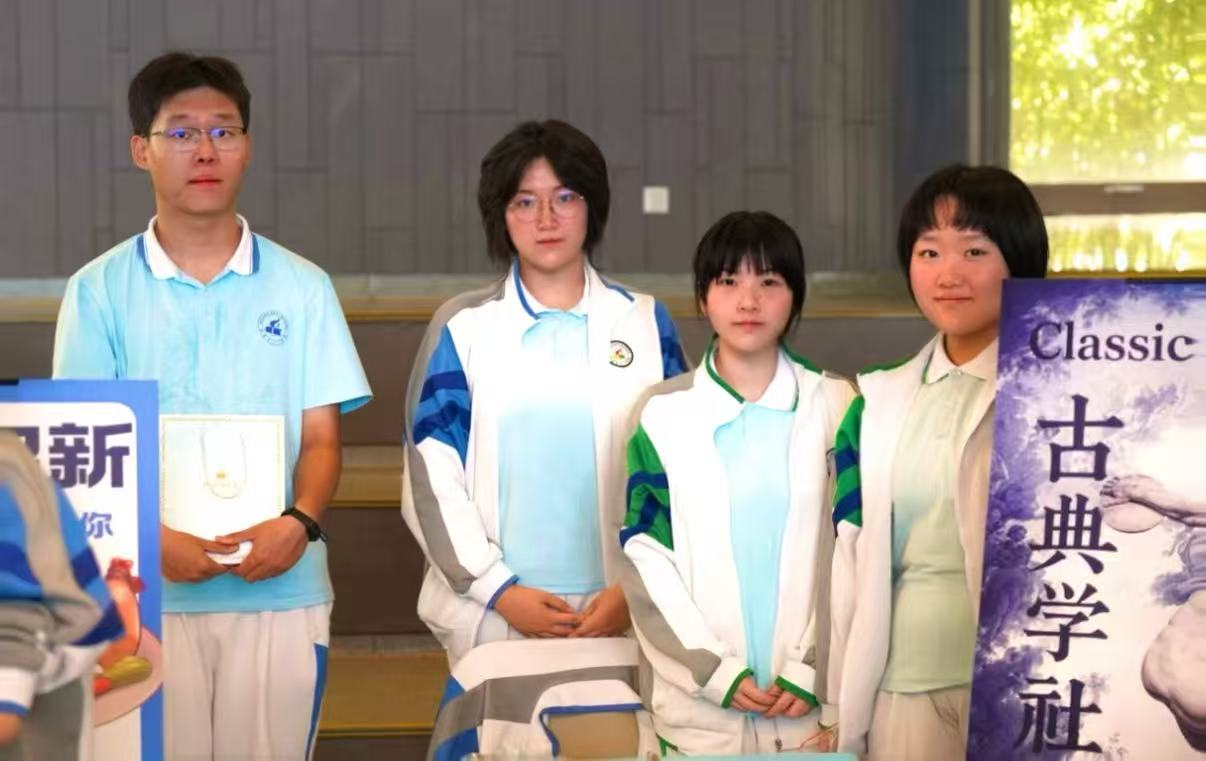 Students with certificates at a school awards ceremony